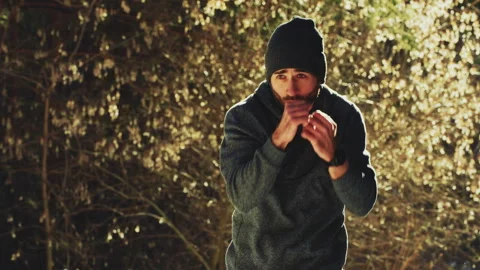 Man boxing in winter forest Video stock 241382179