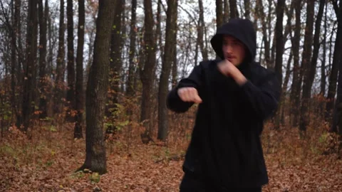 Man Boxing in the woods Stock Footage 142387489