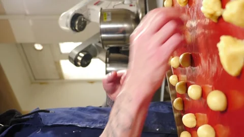 Man breadmaker employee in artisan bakery workshop preparing dough in circle Stock Footage 274339124
