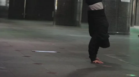 Man breakdancing and standing on hands Stock Footage 68752667