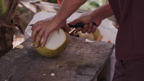 Man Breaking Fresh Coconut First Time Stock Footage 287170365