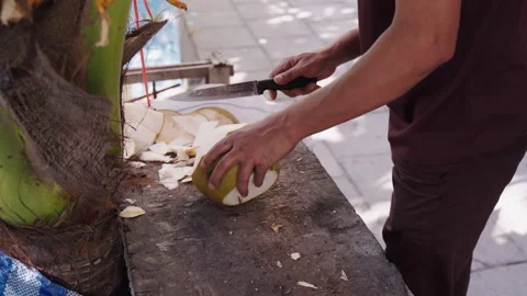Man Breaking Fresh Coconut First Time Stock Footage 287170478