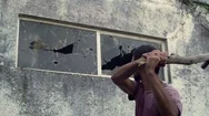 Man Breaking The Glass Window With Wood In Slow Motion Stock Footage