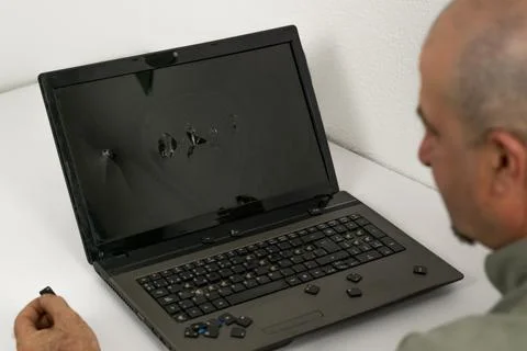 Man breaking pc with hammer Stock Photos