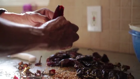 Man Breaking Peppers for Salsa Video stock 76032492