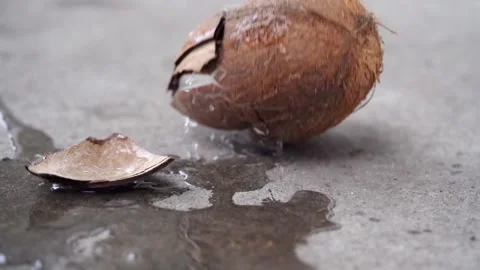 A man breaking raw coconut from hammer Stock Footage 150383587