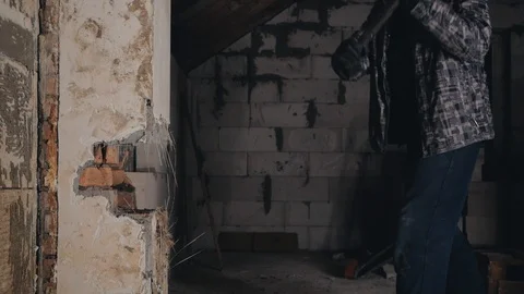 Man breaks brick wall with sledgehammer Stock Footage 124127526