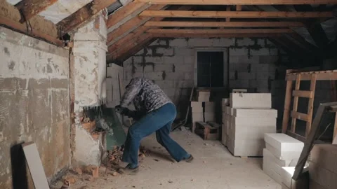 Man breaks brick wall with sledgehammer Stock Footage 225445832