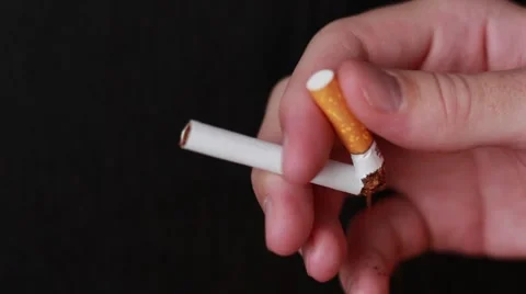 Man breaks a cigarette Stock Footage 65372286