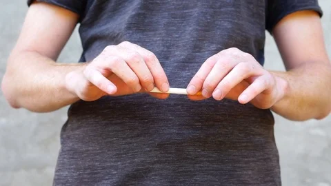 A man breaks a cigarette Stock Footage 94831348