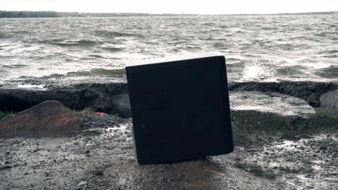 Man breaks a computer with a sledgehammer. A man destroys a computer on the Stock Photos
