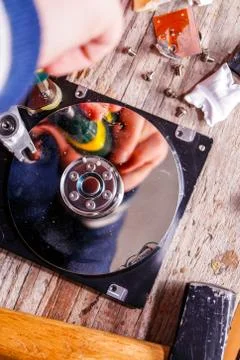 A man breaks a computer using locksmith tools. Stock Photos