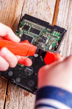 A man breaks a computer using locksmith tools. Stock Photos