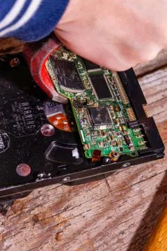 A man breaks a computer using locksmith tools. Stock Photos