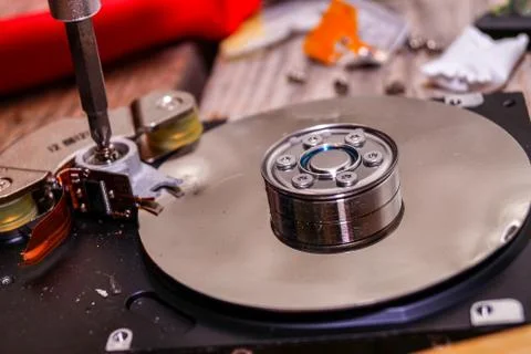 A man breaks a computer using locksmith tools. Stock Photos