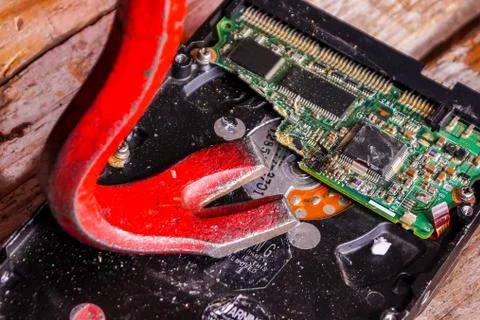 A man breaks a computer using locksmith tools. Stock Photos