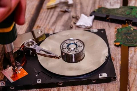 A man breaks a computer using locksmith tools. Stock Photos