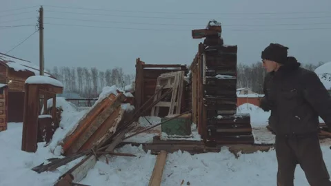 A man breaks down a house Stock Footage 323967314