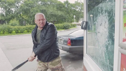 Man breaks glass 2 Stock Footage 107091562