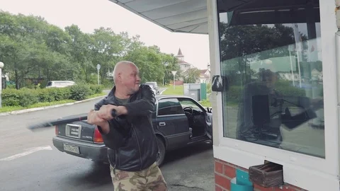 Man breaks glass Stock Footage 107091563