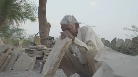 Man breaks the rock Stock Footage 121708503