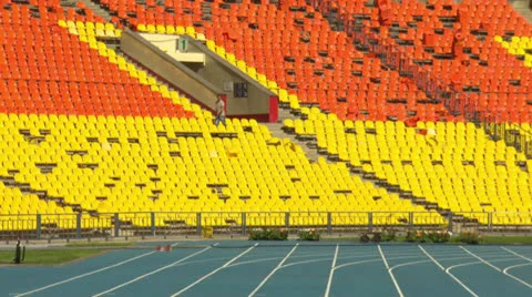 Man breaks seats in the stadium Stock Footage 24788513