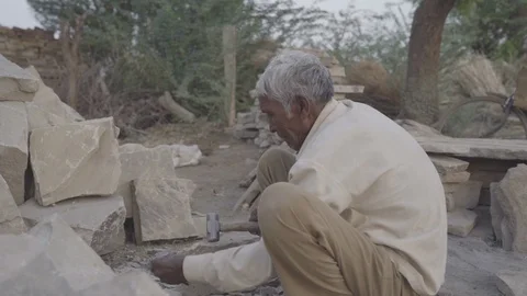Man Breaks Stone Stock Footage 121781740