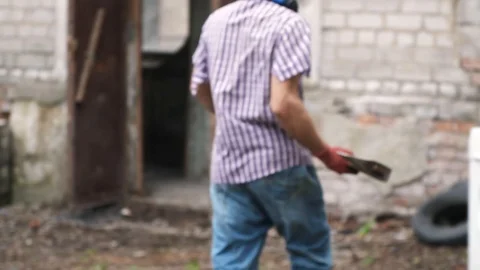 Man breaks a washing machine with a big hammer, home appliances Stock Footage 111899075