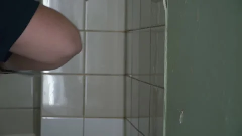 Man breaks white tiles with a hammer 스톡 동영상 160597552
