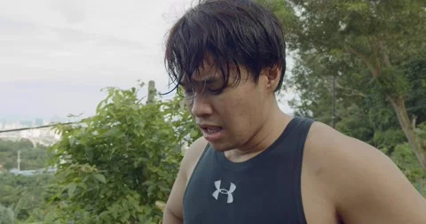 A man breathing preparing for run - medium close up Video stock 146103667