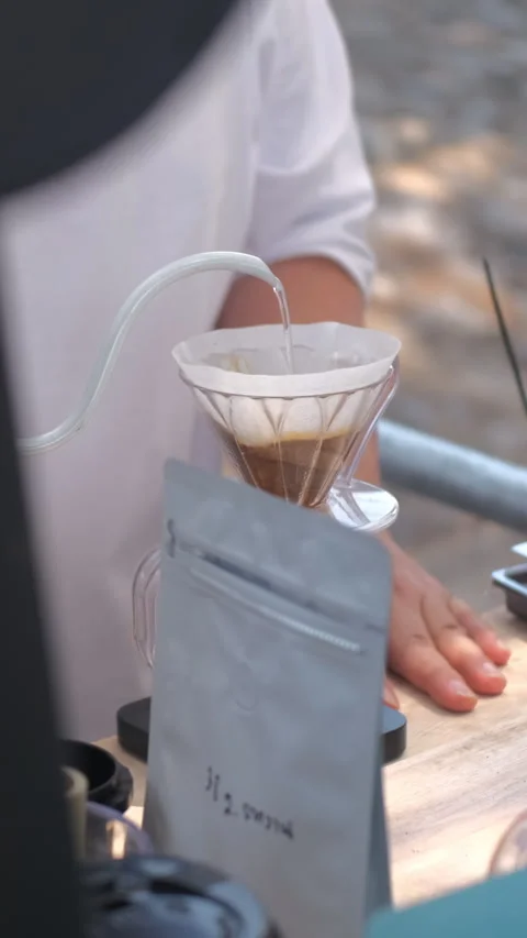 Man brewing coffee with pour over kettle Stock Footage 344954473