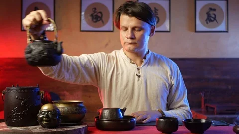 A man brews PU-erh tea according to traditional Chinese customs Stock Footage 114319643