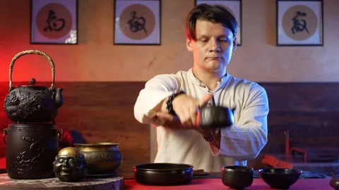 A man brews PU-erh tea according to traditional Chinese customs Stock Footage 114319709