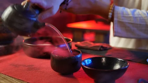 A man brews PU-erh tea according to traditional Chinese customs Stock Footage 114319713