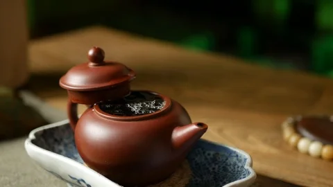 A man brews PU-erh tea according to traditional Chinese customs Stock Footage 114418372