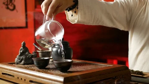 A man brews PU-erh tea according to traditional Chinese customs Stock Footage 114602136