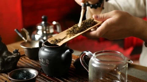 A man brews PU-erh tea according to traditional Chinese customs Stock Footage 114602138