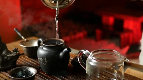 A man brews PU-erh tea according to traditional Chinese customs Stock Footage 114602165