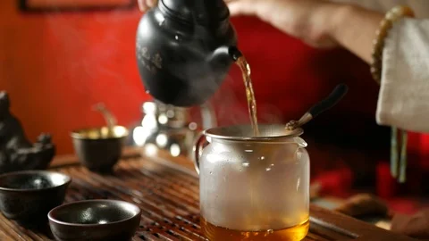 A man brews PU-erh tea according to traditional Chinese customs Stock Footage 114602182