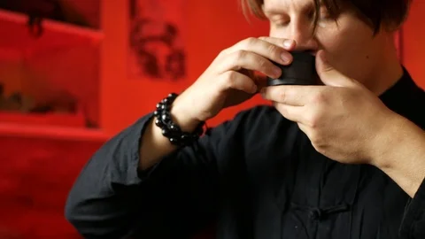 A man brews PU-erh tea according to traditional Chinese customs Stock Footage 114818429
