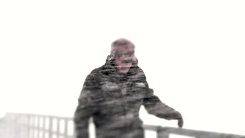 Man on a Bridge During a Snow Storm Stock Footage 162256981
