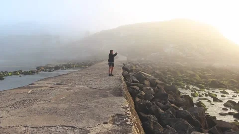 MAN IN THE BRIDGE TAKING PHOTO Stock Footage 94231920