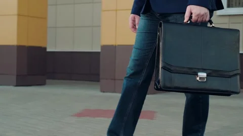 Man with briefcase in hand ready to attend important meeting walking to office Stock Footage 254898358