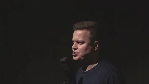 A man broadcasts something into a microphone Stock-Footage 230618074