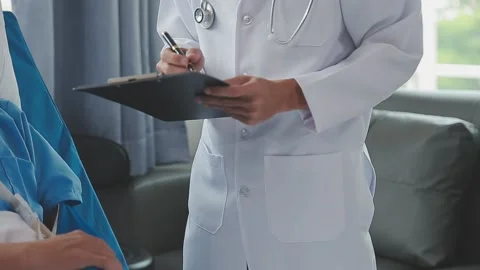 Man with broken arm in cast lying on bed in hospital. The emergency center .. Stock Footage 237335866