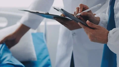 Man with broken arm in cast lying on bed in hospital. The emergency center .. Stock Footage 237356778