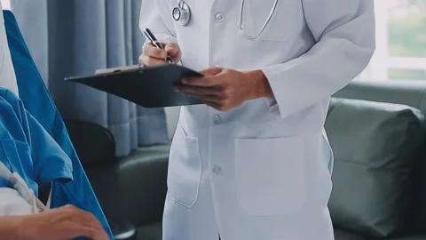 Man with broken arm in cast lying on bed in hospital. The emergency center .. Stock Footage 237356801