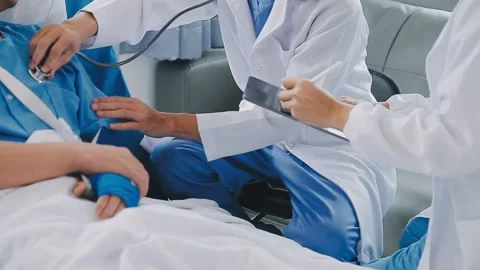 Man with broken arm in cast lying on bed in hospital. The emergency center .. Stock Footage 237356808