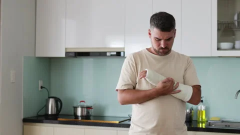 Man with broken arm is in pain. Stock Footage 289619034