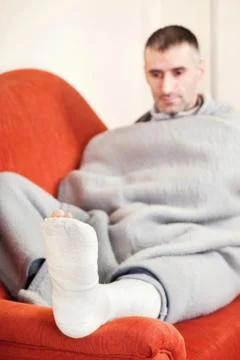 Man with broken leg Stock Photos